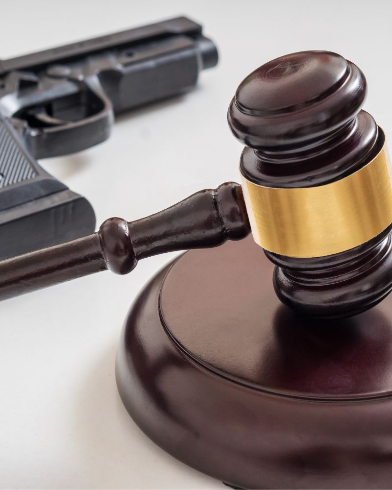 Gavel and firearm representing weapons charges and criminal defense in Washington, DC