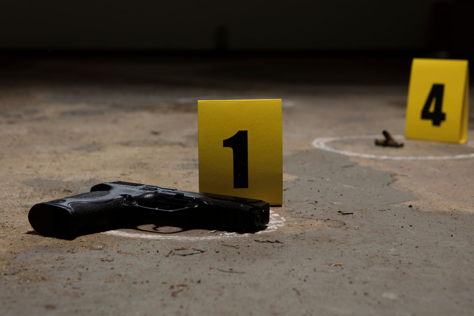 Firearm at a crime scene representing weapons charges investigation